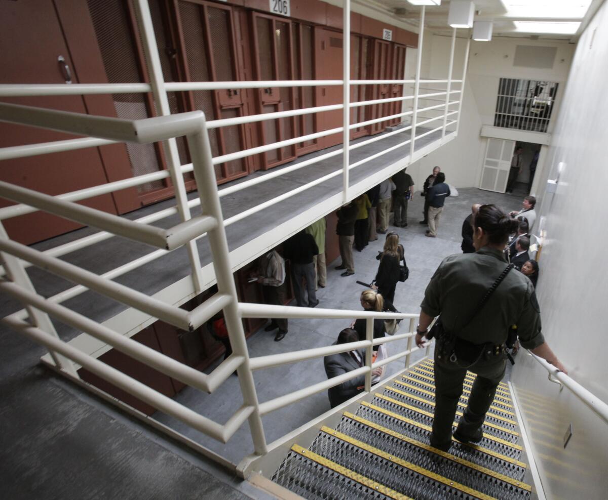 Reporters inspect one of the two-tiered cell pods in the Secure Housing Unit at the Pelican Bay State Prison near Crescent City, Calif. in 2011.