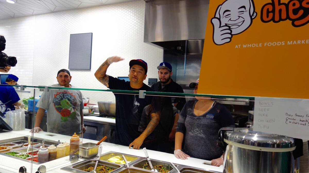 Restaurateur Roy Choi explains the Chego multi-cultural rice bowl concept at the 2015 grand opening of Whole Foods Market in downtown L.A.