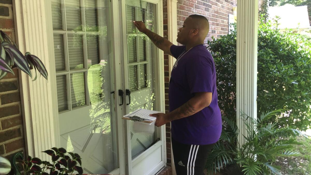 New Georgia Project staffer Roderick Smith knocks on doors in Doraville, one of many communities in Georgia's 6th Congressional District where the group is working to register minority voters before the June 20 runoff.