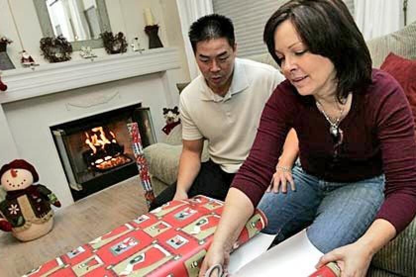 Hoss and Janene Ghitkammanee are not facing foreclosure, but they fear the flood of foreclosures in their neighborhood will lead to its deterioration and further damage to their house value and net worth.