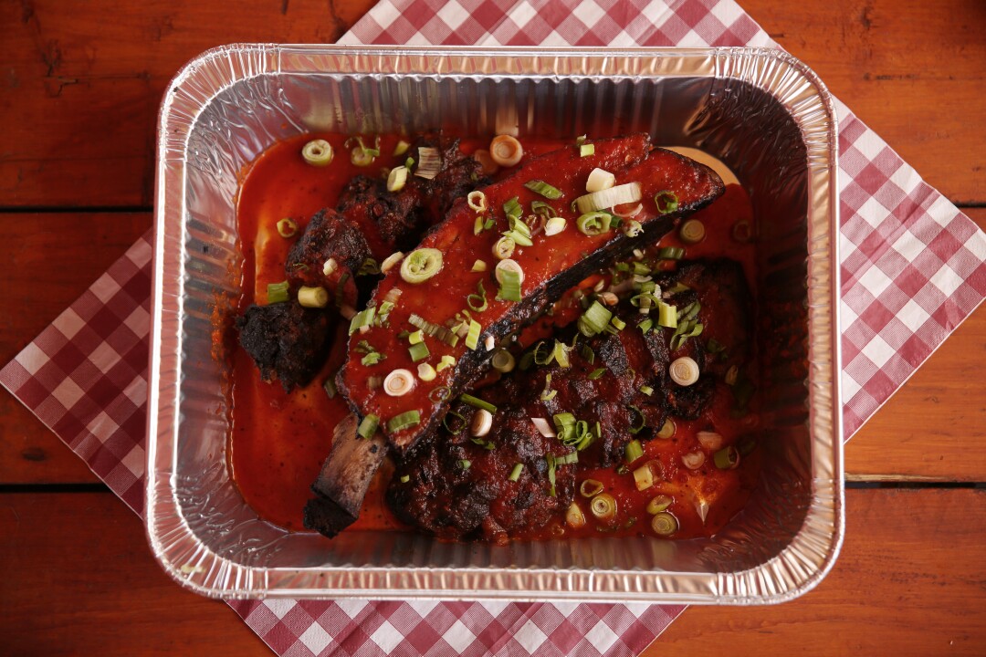 A plate of ribs are seen at John Mull's Meats & Road Kill Grill.