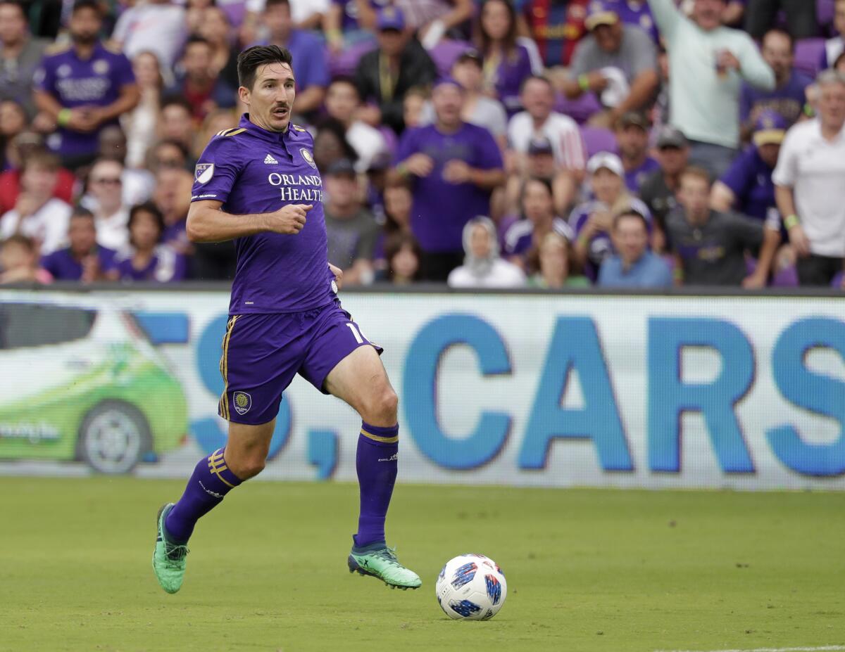 Orlando City's Sacha Kljestan moves the ball against Real Salt Lake during the second half of an MLS soccer match, Sunday, May 6, 2018, in Orlando, Fla. (AP Photo/John Raoux)