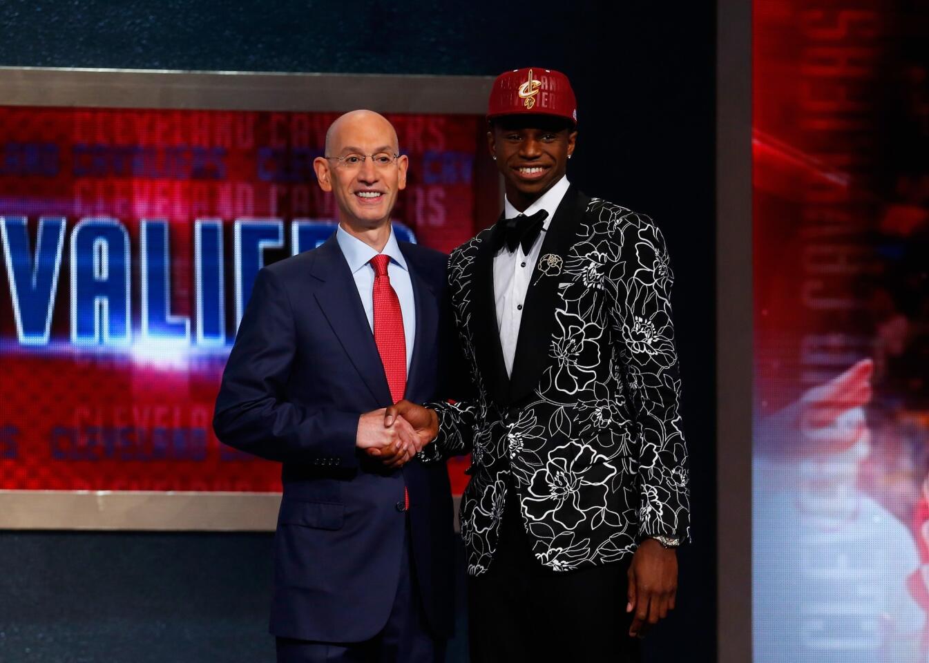 The Cavaliers selected Kansas small forward Andrew Wiggins, right, with the No. 1 overall pick.