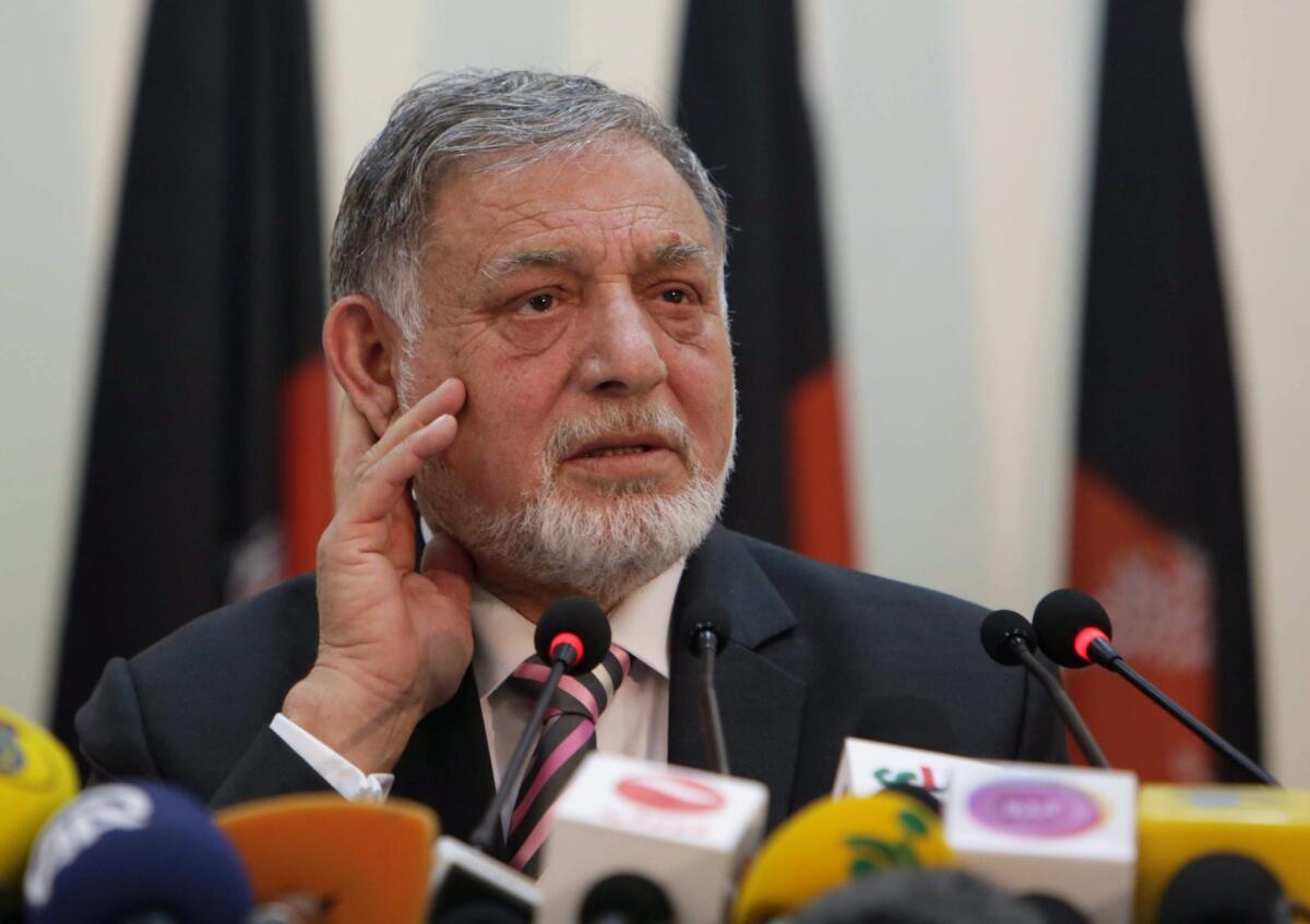Ahmad Yusuf Nuristani, head of the Independent Election Commission, announces result of the first round of Afghanistan's presidential vote in Kabul on Saturday.