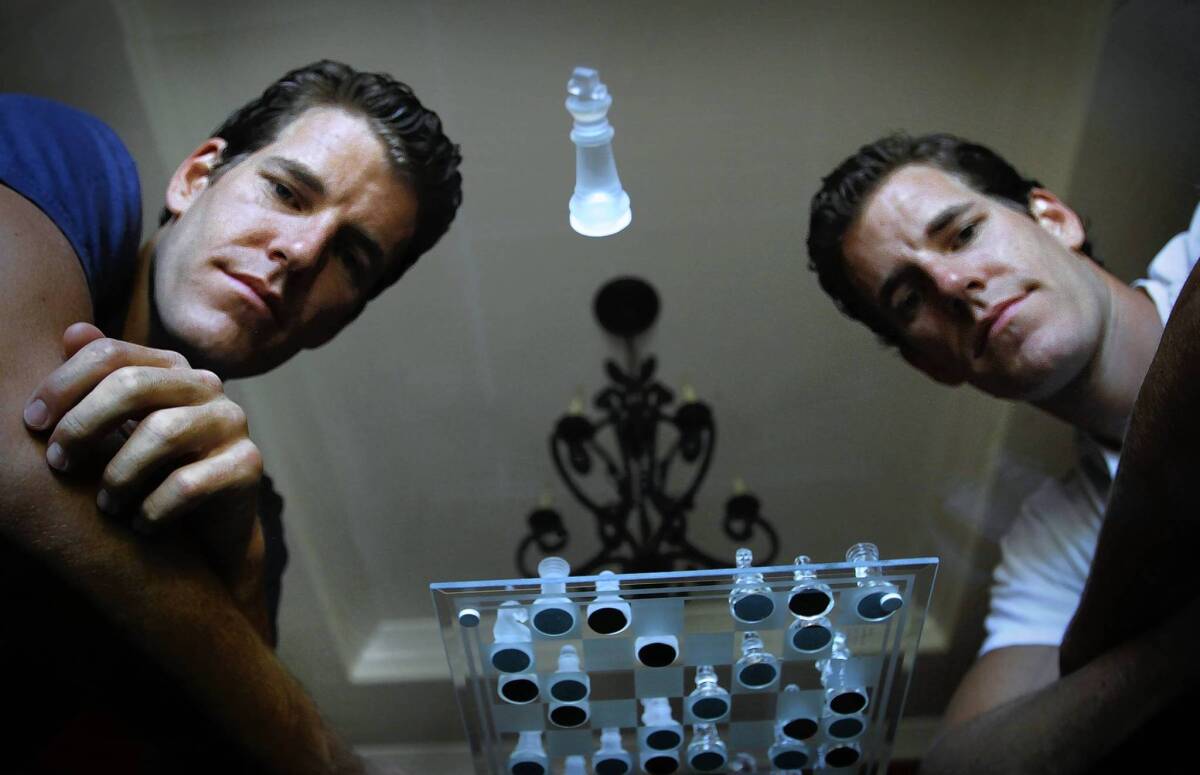 Tyler Winkelvoss, left, and his twin, Cameron Winklevoss, want to give investors a piece of the Bitcoin virtual currency.