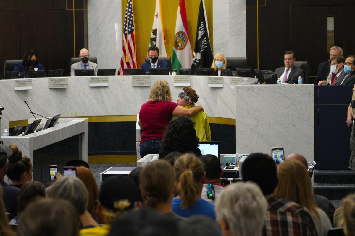 Cindy Paris and her daughter Gracie, 16, speak at the county Board of Supervisors meeting.
