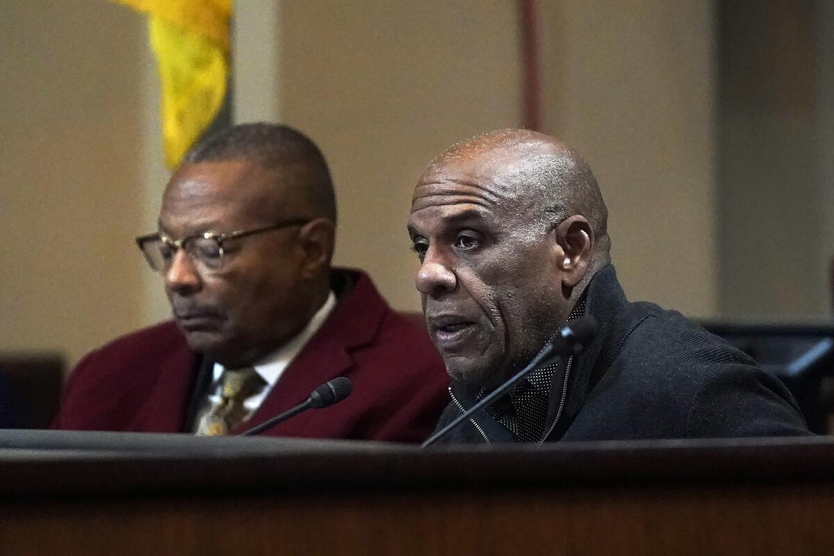 A man, right, speaks during a meeting by the Task Force to Study and Develop Reparation Proposals for African Americans.