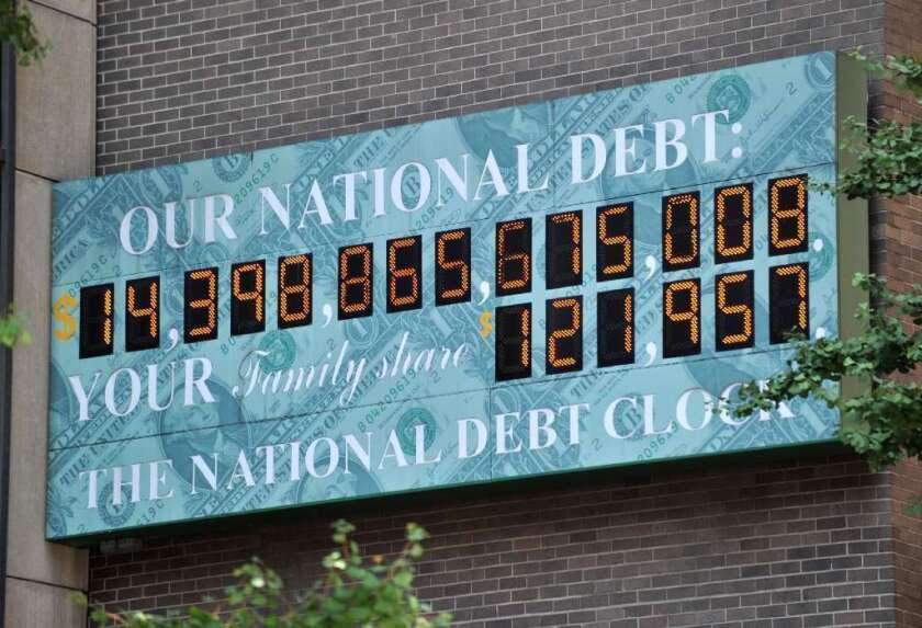 The National Debt Clock, a billboard-size digital display showing the increasing U.S. debt, near an office of the Internal Revenue Service on 6th Avenue in New York City back in July.