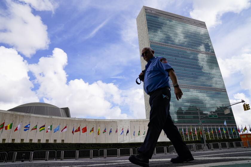 A member of the FDNY passes outside the United Nations headquarters, Tuesday, Sept. 21, 2021, during the 76th Session of the U.N. General Assembly in New York. (AP Photo/John Minchillo, Pool)