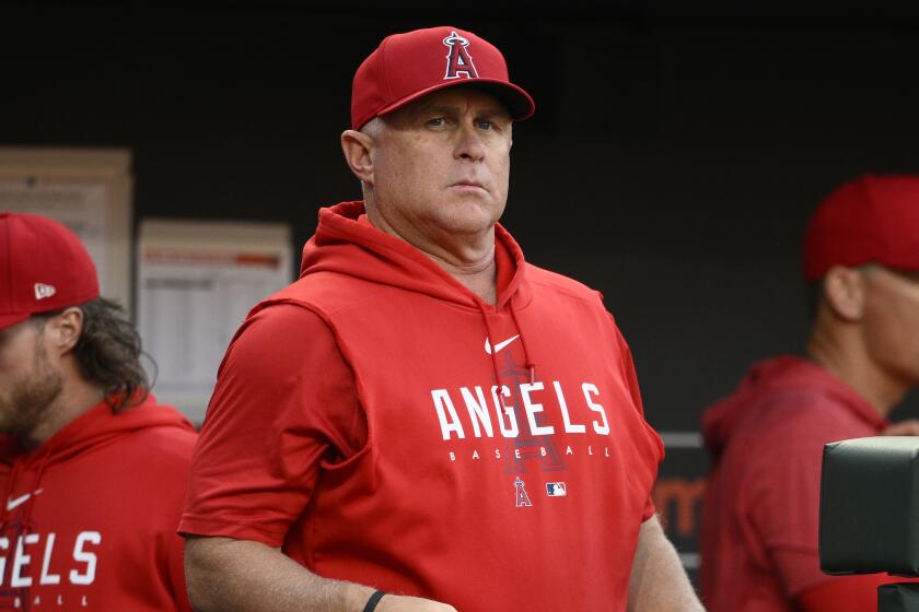 Los Angeles Angels manager Phil Nevin looks on during a baseball game.