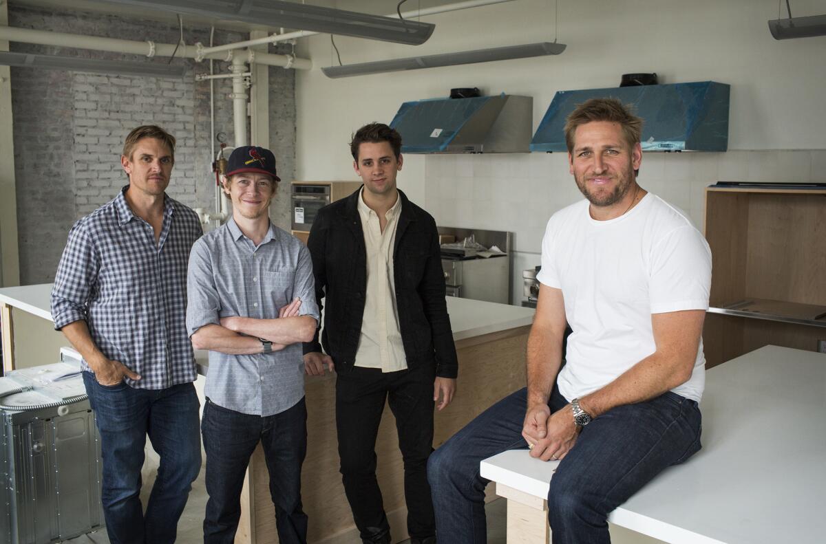 Australian Chef Curtis Stone, right, and his brother Luke Stone will get the help of butchers Daniel Roderfeld, left-center, and Alex Jermasek, at Gwen's new upstairs test kitchen.