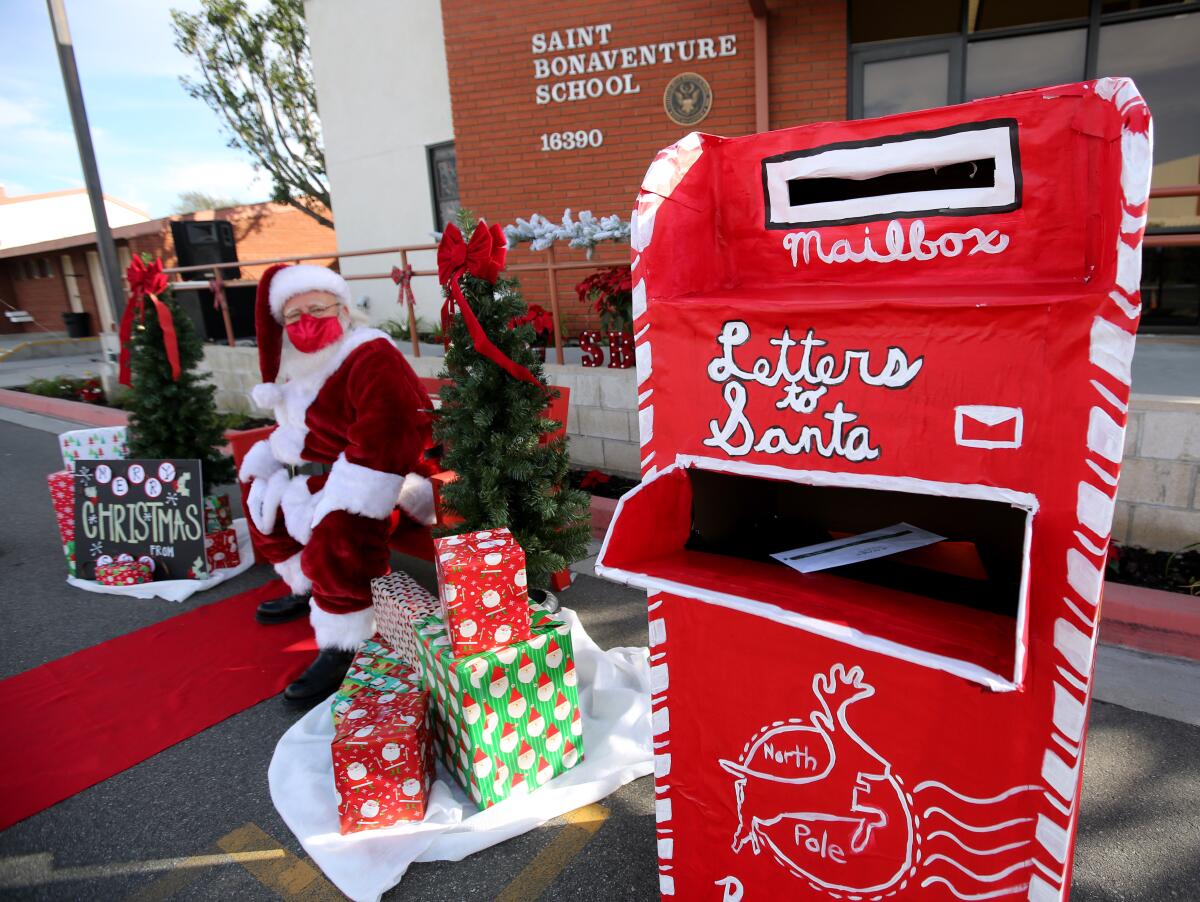 Santa Claus (Lou Martinez) brought his large mailbox to St. Bonaventure Catholic School.