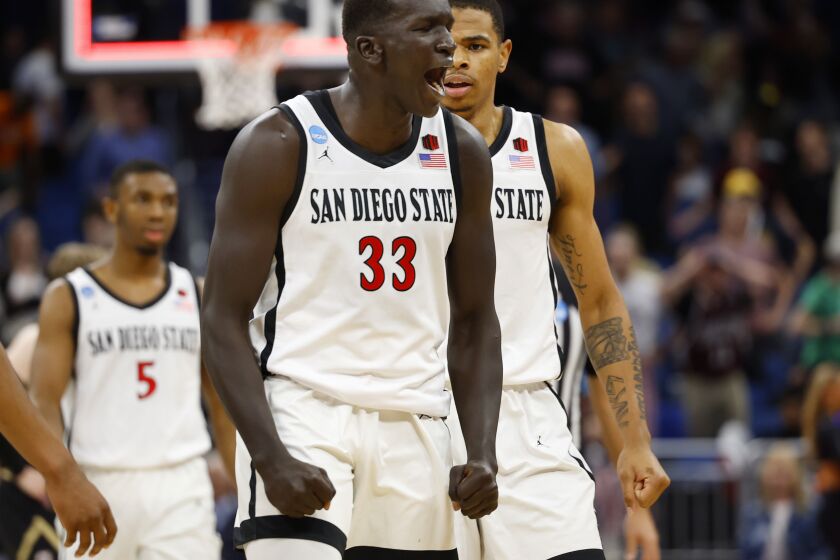 Orlando, FL - March 16: San Diego State's Aguek Arop celebrates during a win against College of Charleston in the first round of the NCAA Tournament in Orlando on Thursday, March 16, 2023.. (K.C. Alfred / The San Diego Union-Tribune)