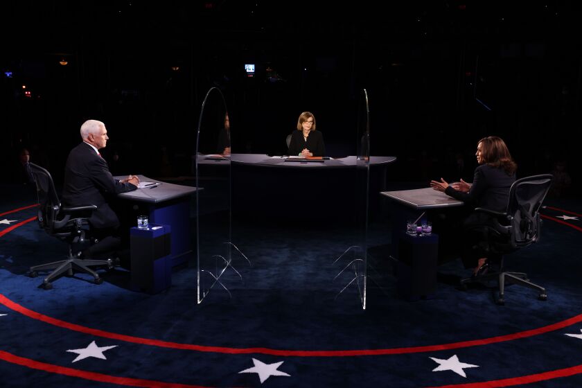 US Vice President Mike Pence (L), US Democratic vice presidential nominee and Senator from California, Kamala Harris (R), moderator Washington Bureau Chief for USA Today Susan Page (C), participate in the vice presidential debate in Kingsbury Hall of the University of Utah October 7, 2020 in Salt Lake City, Utah. (Photo by Justin Sullivan / POOL / AFP) (Photo by JUSTIN SULLIVAN/POOL/AFP via Getty Images)