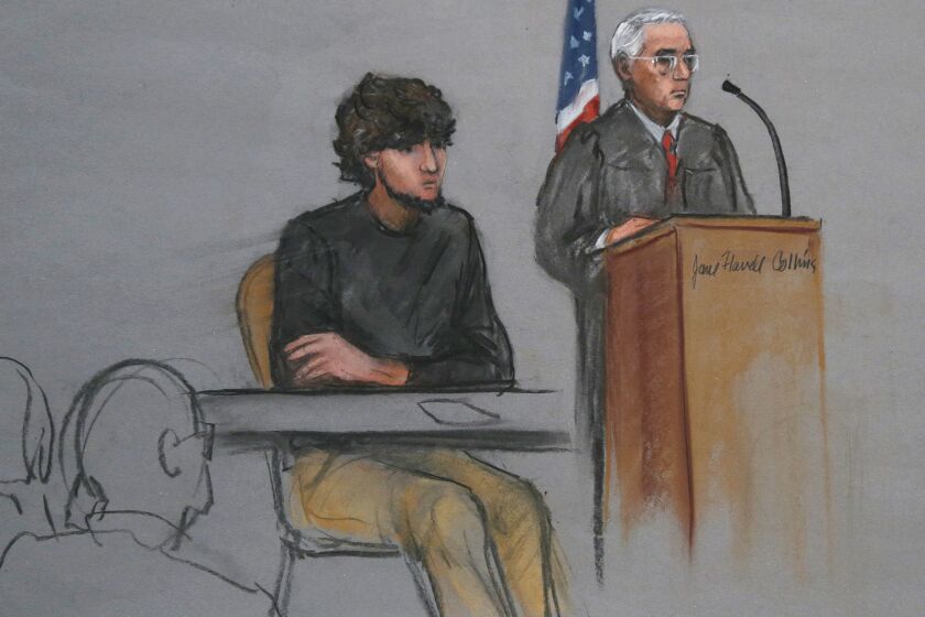 Boston Marathon bombing suspect Dzhokhar Tsarnaev sits as U.S. District Judge George O'Toole Jr. addresses a pool of potential jurors last month in Boston.