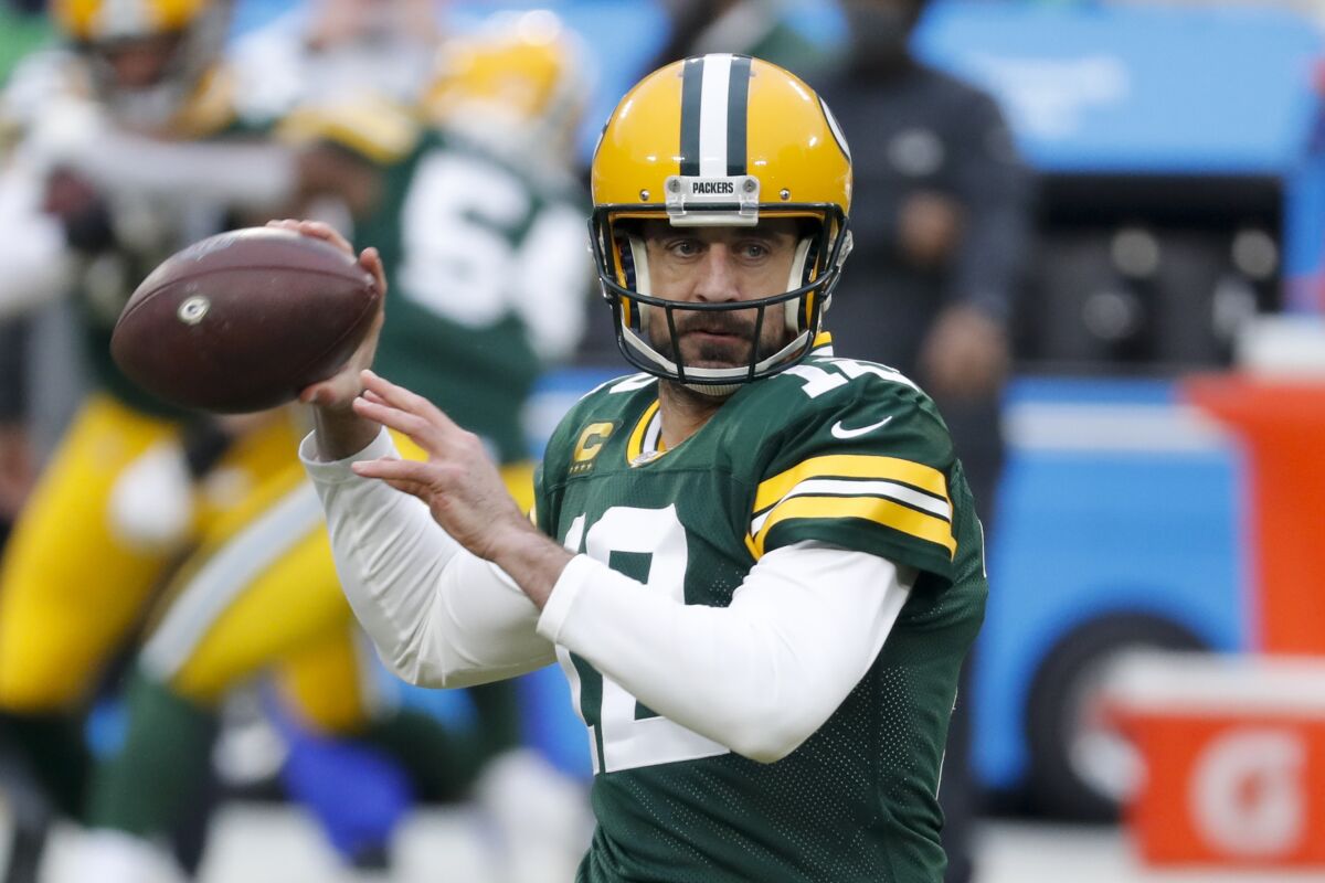 Green Bay Packers quarterback Aaron Rodgers warms up.