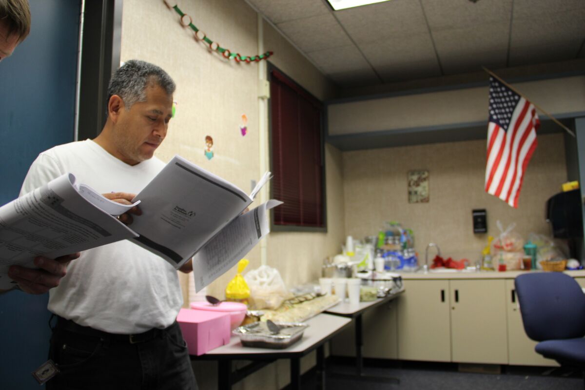 The Los Angeles-based organization Families in Schools trained Moreno Valley teachers to lead a series of bilingual workshops on how parents — even if they do not speak English, or know how to read — can help their students learn English. Jose Perez attends a workshop at Mountain View Middle School.