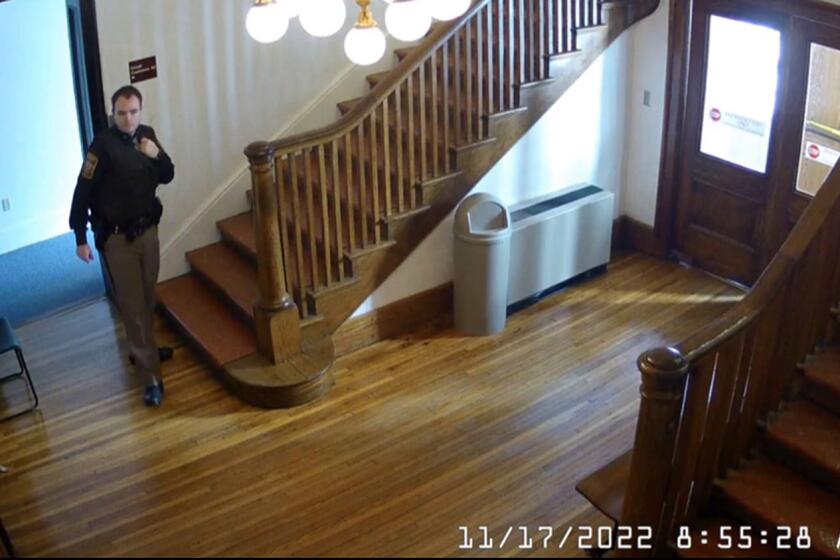 Surveillance camera footage obtained from official court document shows Austin Lee Edwards, who served as a bailiff in the Washington County Courthouse, during his second day on the job with the Washington County Sheriff's Office.