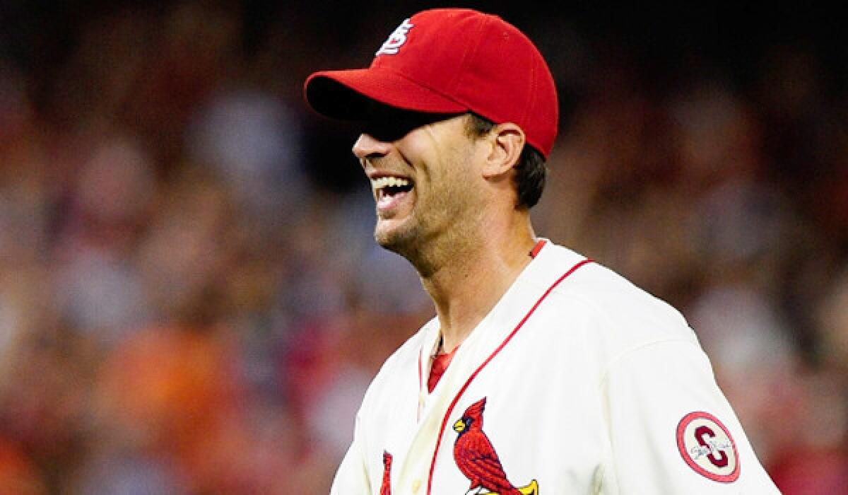 St. Louis pitcher Adam Wainwright smiles after throwing a complete game for a 7-1 victory over the San Francisco Giants on Saturday.