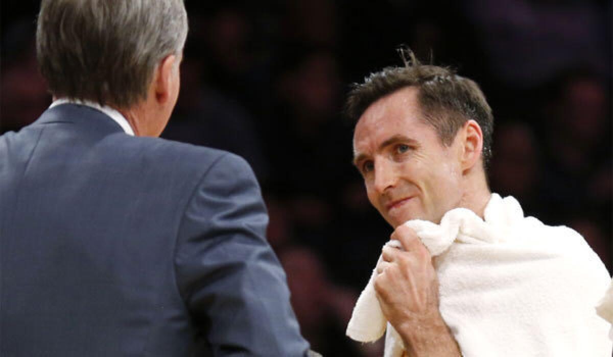 Lakers point guard Steve Nash, shown talking to Coach Mike D'Antoni, will miss at least the next two games.