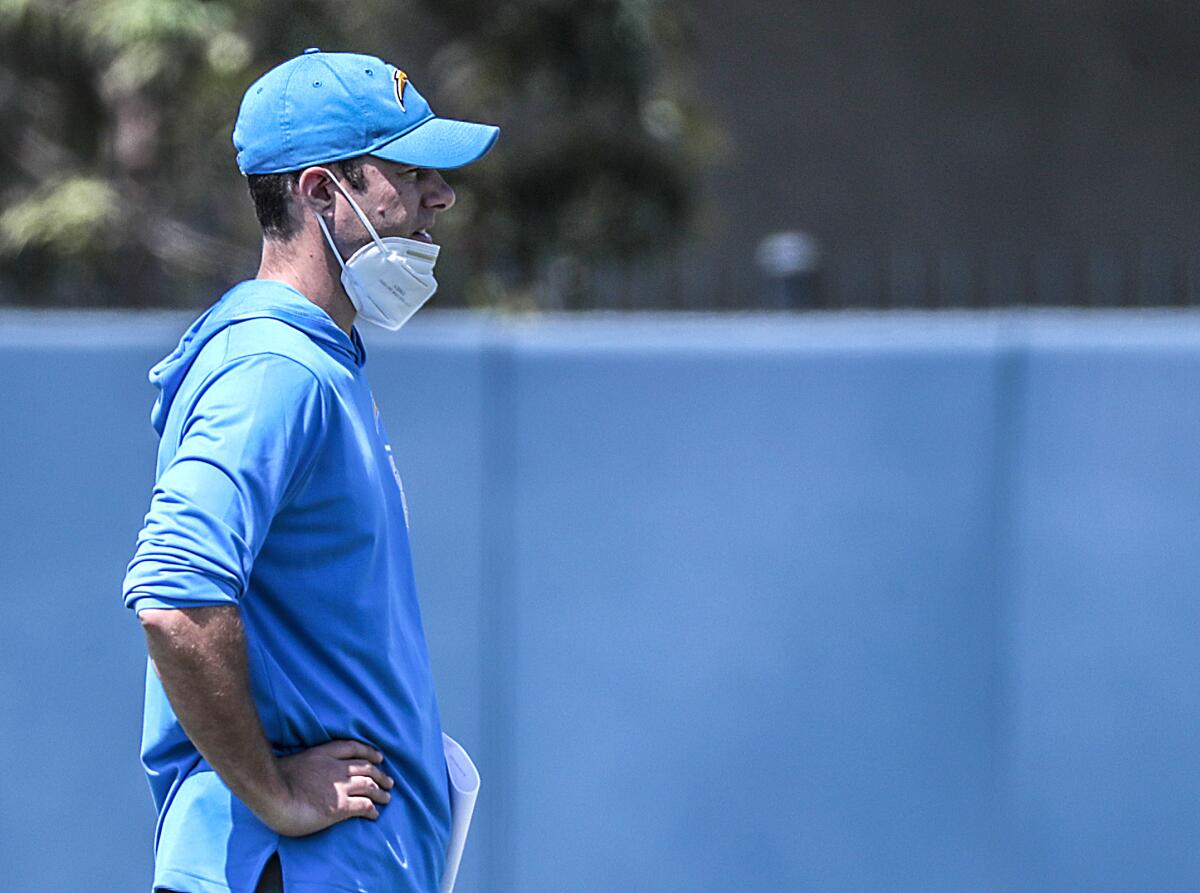 Chargers coach Brandon Staley looks on as rookies work out during a minicamp.