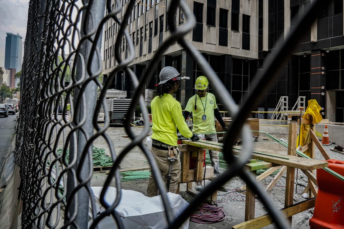 Construction workers work with rebar at a site on Tuesday June 6, 2023, in New York. 