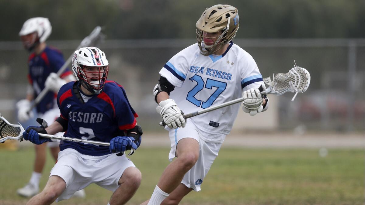 Simon Hall (27), shown in action on March 31, and the CdM boys' lacrosse team will play at home against Corona Santiago on Tuesday in the first round of the U.S. Lacrosse Southern Section South Division playoffs.