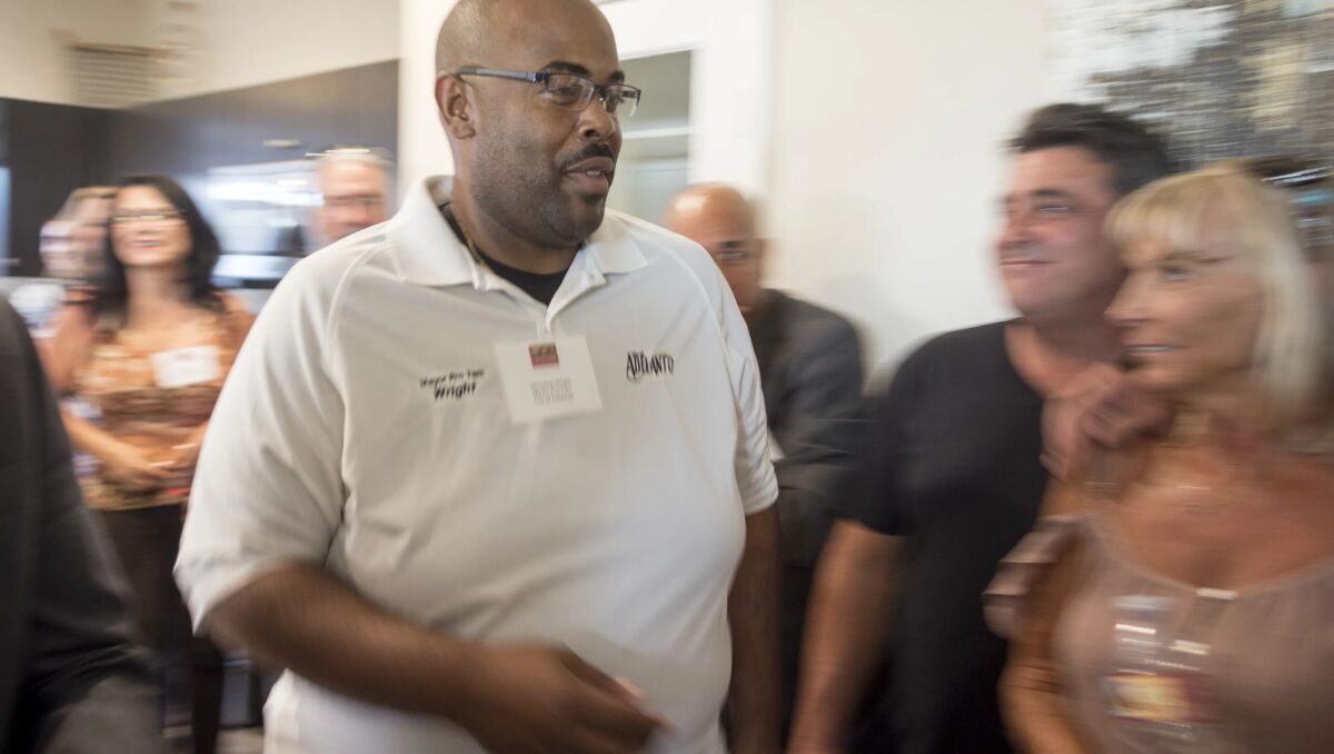 A man walks past a line of people