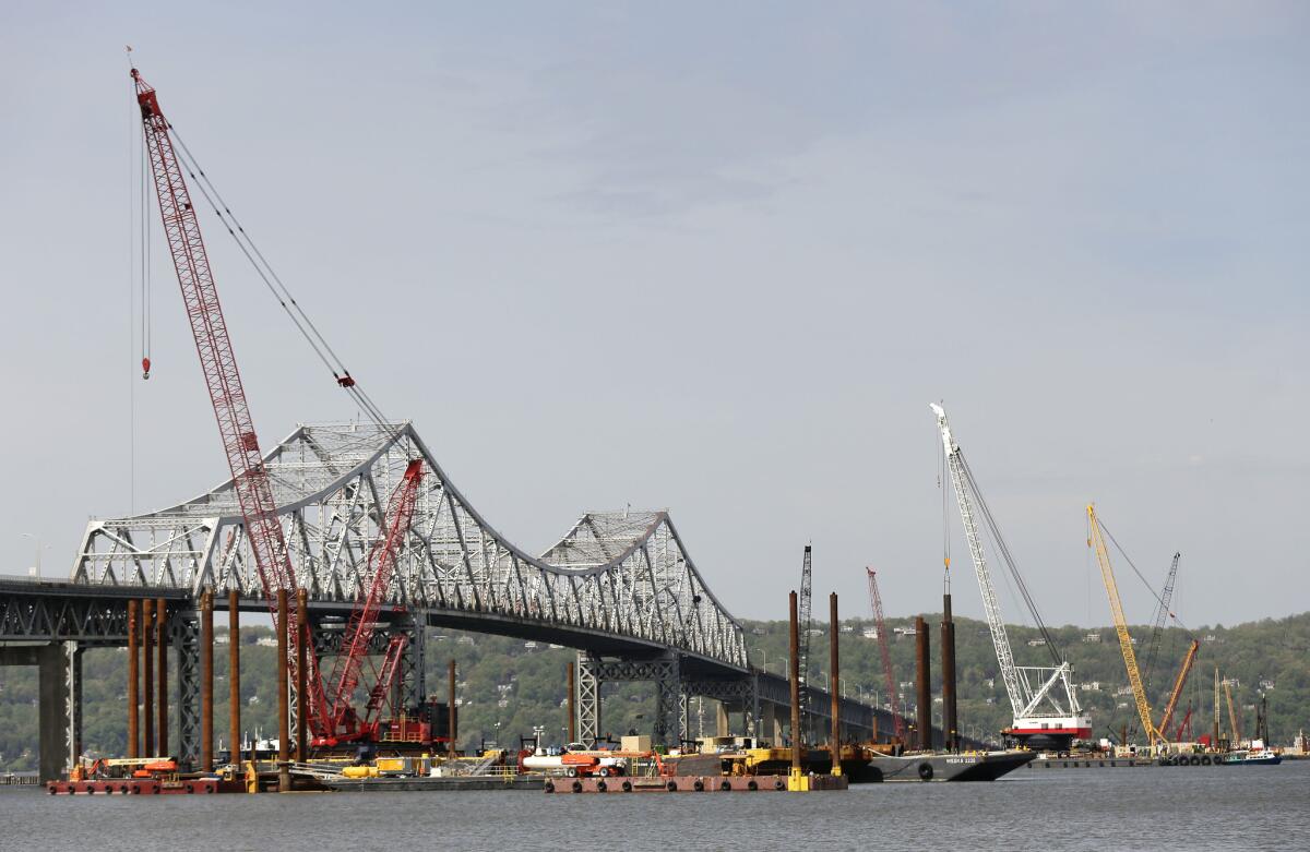 Construction crews use barges and cranes as work continues on a replacement for the 58-year-old Tappan Zee Bridge spanning the Hudson River.