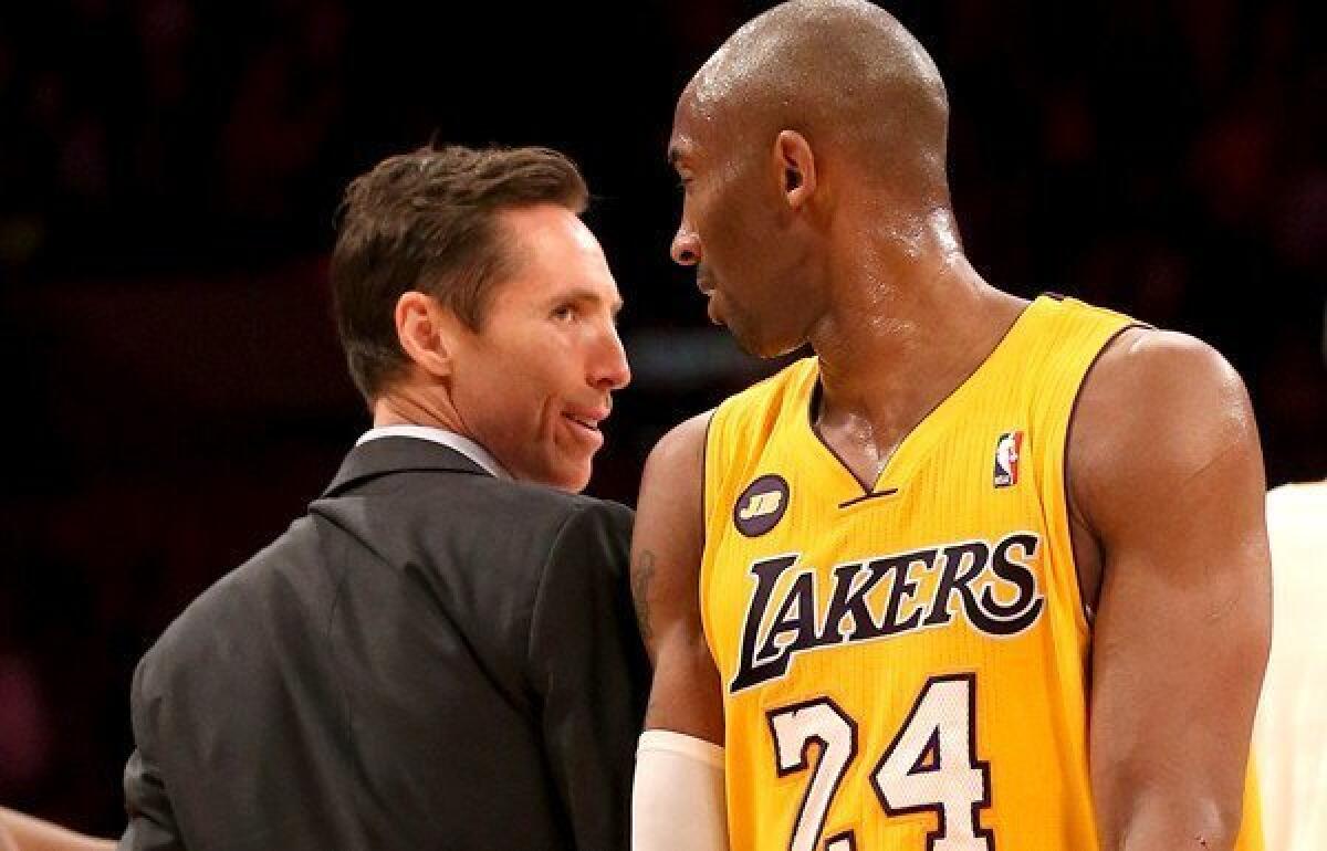 Steve Nash, chatting with teammate Kobe Bryant, will be in street clothes again Friday night when the Lakers host Golden State.