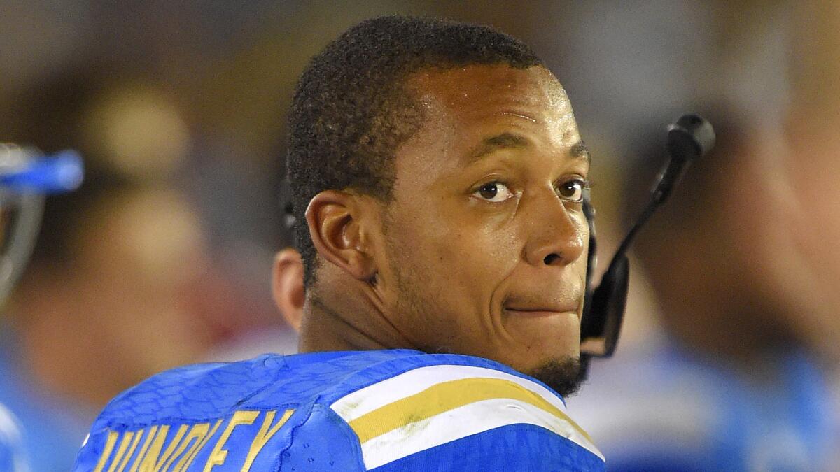 UCLA quarterback Brett Hundley looks on from the sideline during the Bruins' 42-35 win Saturday over Memphis.