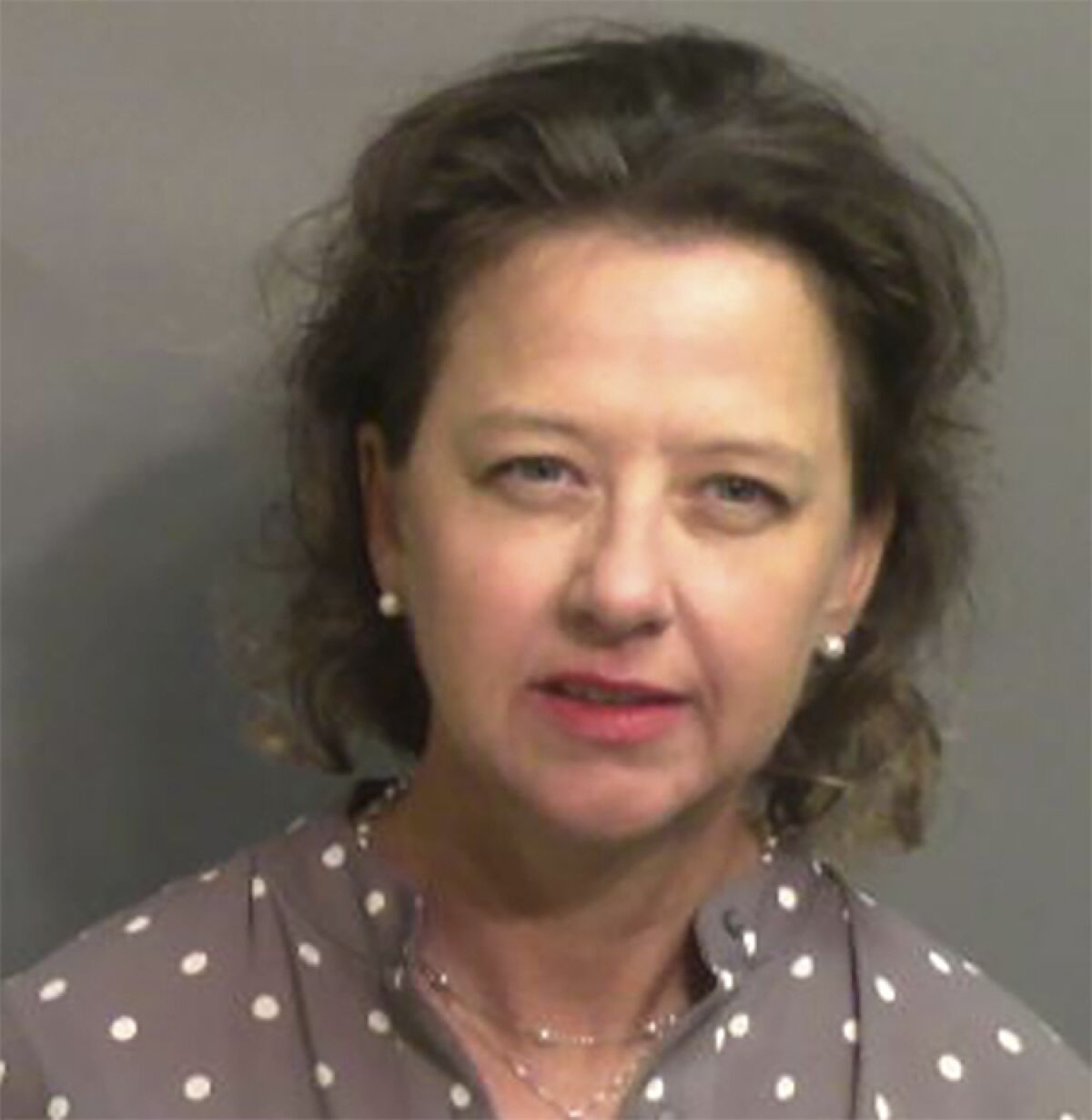 FILE - This jail booking photo provided by Glynn County Sheriff's Office, shows Jackie Johnson, the former district attorney for Georgia's Brunswick Judicial Circuit, after she turned herself in to the Glynn County jail in Brunswick, Ga, on Wednesday, Sept. 8, 2021. One of the men convicted of murder in the street chase and fatal shooting of Ahmaud Arbery spoke with Johnson, his former boss, the local district attorney, several times by phone in the days and weeks following the 2020 killing, according to a court document filed Thursday, May 4, 2022.(Glynn County Sheriff's Office via AP, File)