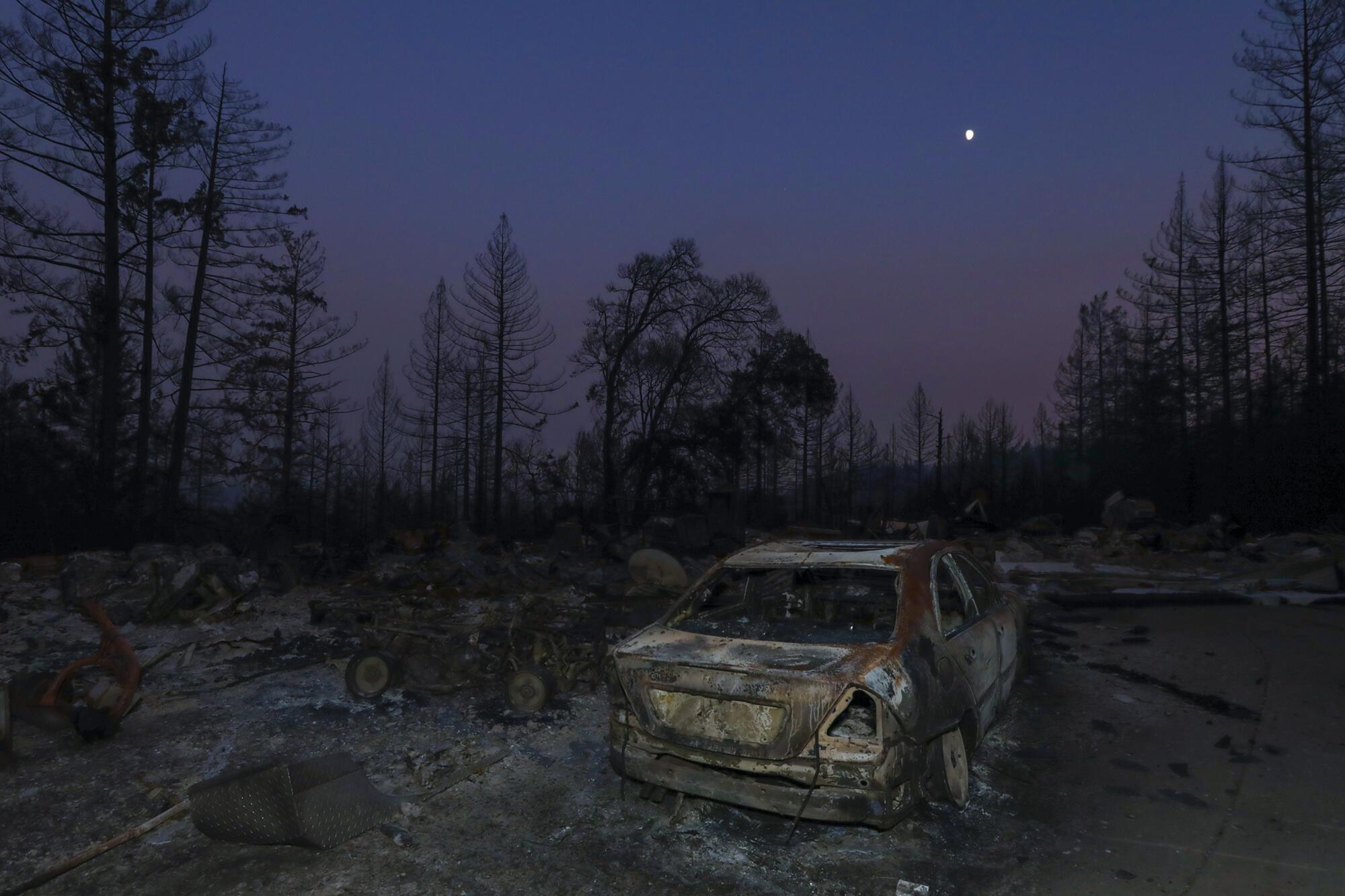 Charred remains of a structure lost to the CZU Lightning Complex fire on Pinecrest Drive in Boulder Creek, Calif.