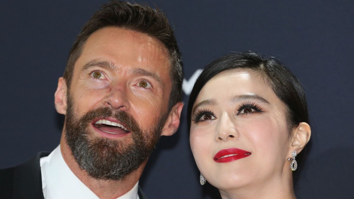 Fan Bingbing and Hugh Jackman arrive at the Australian premiere of "X-Men: Days of Future Past" on May 16, 2014, in Melbourne, Australia.