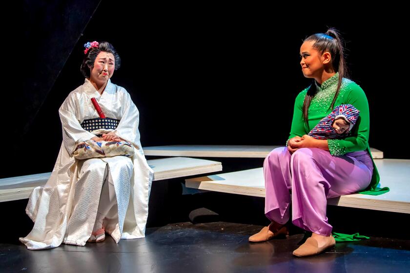 Julia Cho and Zandi De Jesus in "This Is Not a True Story," a show presented by Artists at Play in association with Latino Theater Company that tackles fetishization and anti-Asian racism. (Grettel Cortes Photography)