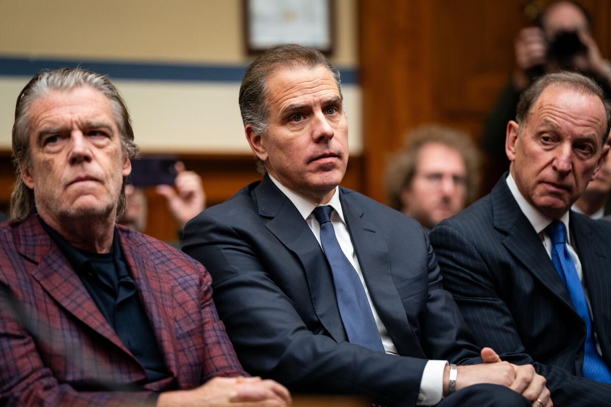 Hunter Biden, flanked by prominent L.A. attorney Kevin Morris, left, and Abbe Lowell