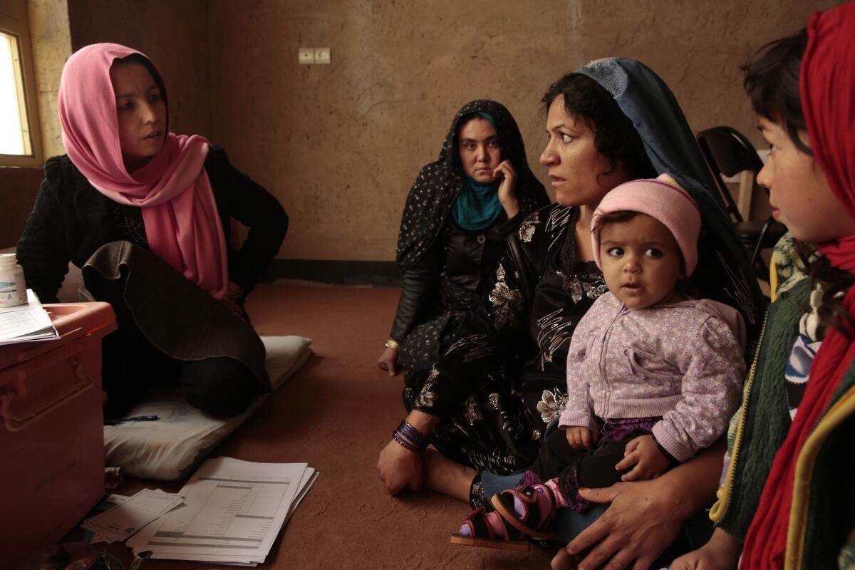 Shukriya Matin, left, directs a private hospital program in Kabul that provides maternal care to village women.