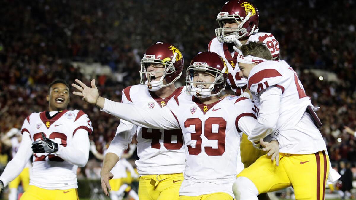USC defensive back Iman Marshall (8) celebrates with teammate Jack Jones (1) after intercepting a pass during the first quarter. To see more images from the game, click on the photo above.