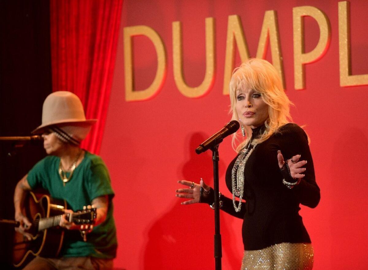 Dolly Parton, right, and Linda Perry were nominated for a Golden Globe for their song "Girl in the Movies" from the film "Dumplin'."