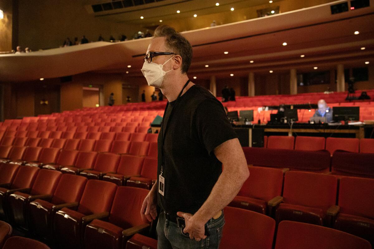 Director James Gray stand in the Dorothy Chandler Pavilion looking on at rehearsal.