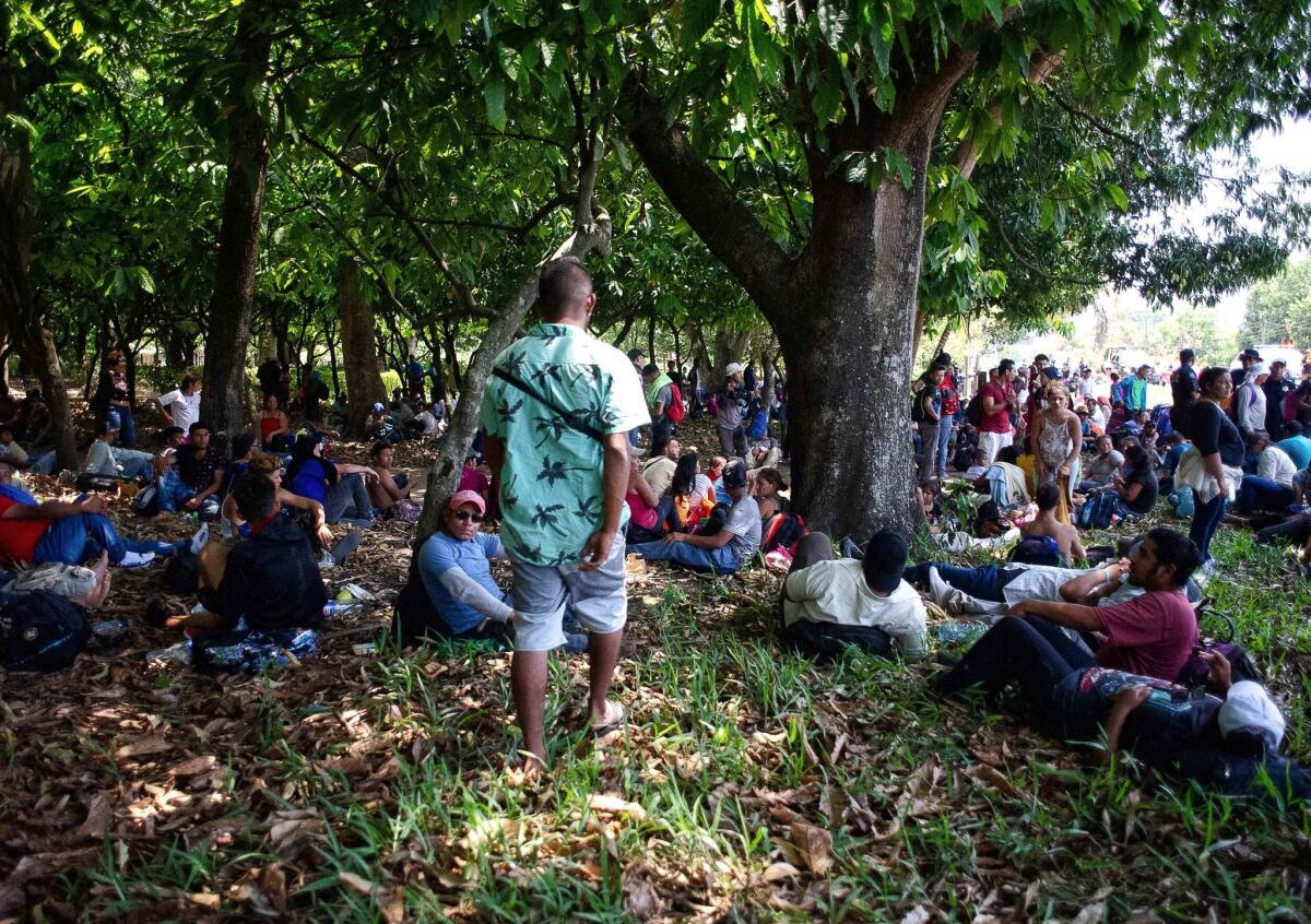 Central American migrants rest Friday between Metapa and Tapachula in southern Mexico.
