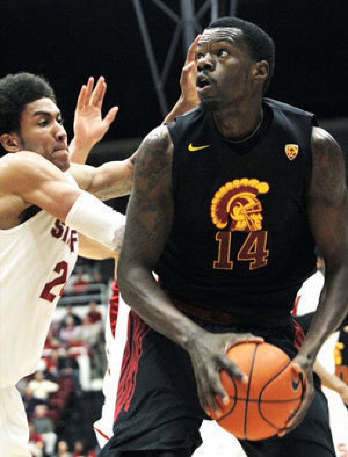 Dewayne Dedmon, right, has been suspended indefinitely from the USC men's basketball team.
