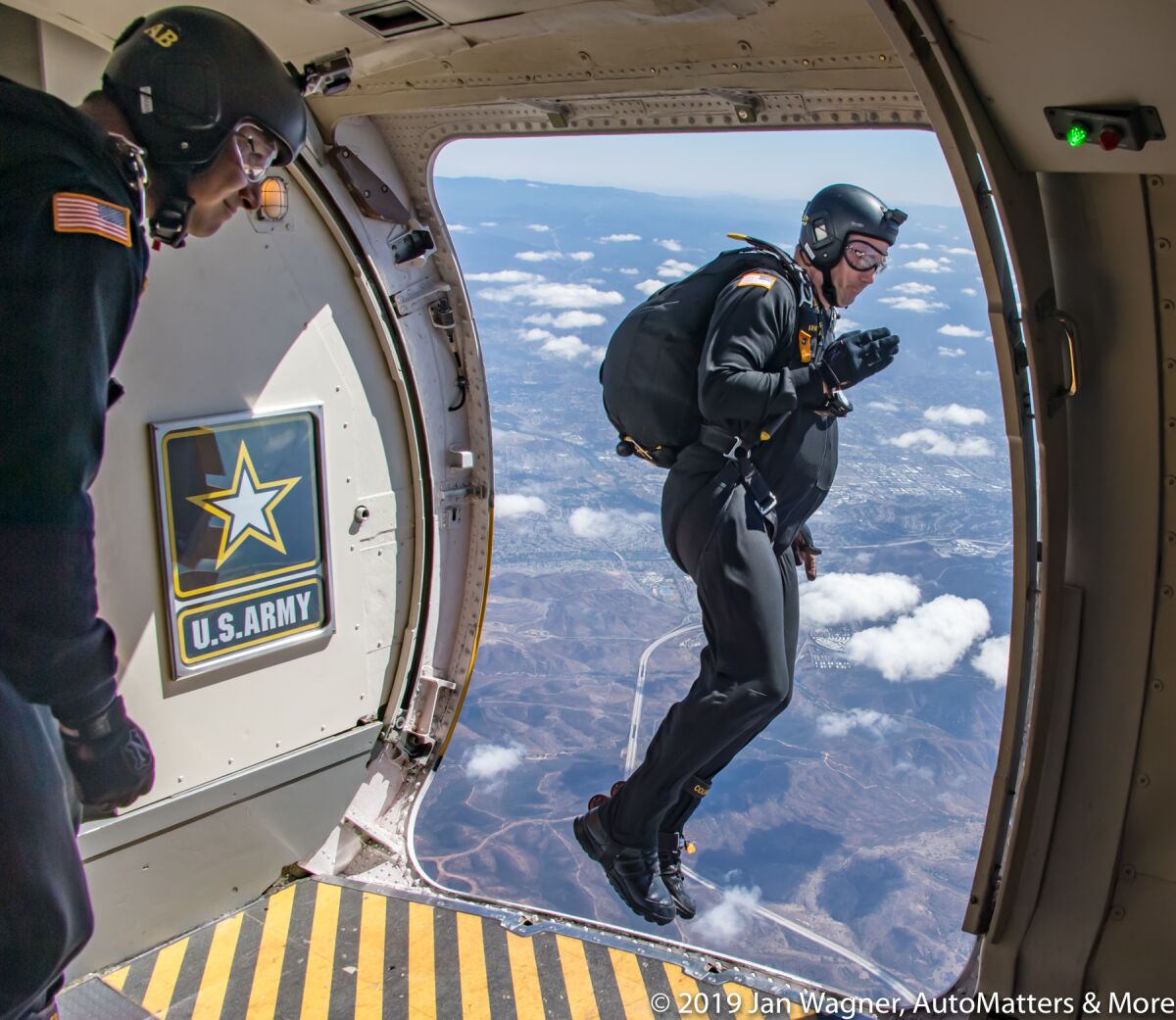 One of the Golden Knights beginning his skydive