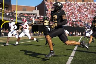 Vanderbilt linebacker Randon Fontenette (2) returns an interception for a touchdown.