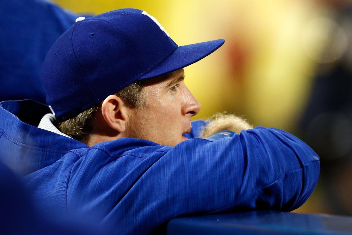 Chase Utley looks on from the Dodgers' dugout during Game 3 against the New York Mets on Monday.