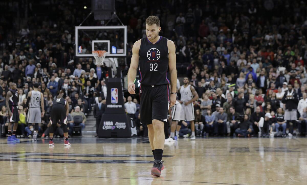 Clippers forward Blake Griffin walks up court during the final seconds of the team's 115-107 loss to San Antonio Spurs on Dec. 18.