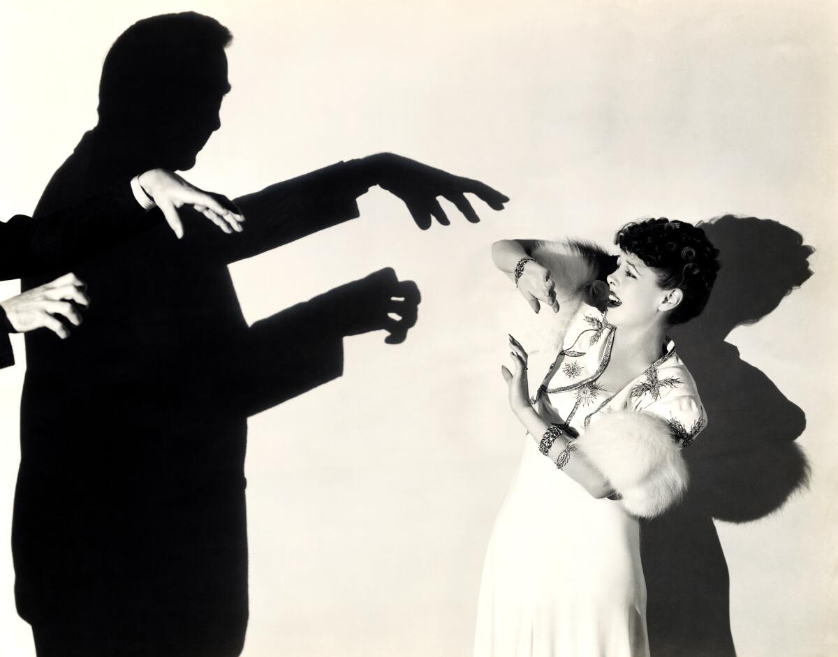 Threatening shadow of Bela Lugosi frightens Anne Nagel in a scene from Universal's "Black Friday."