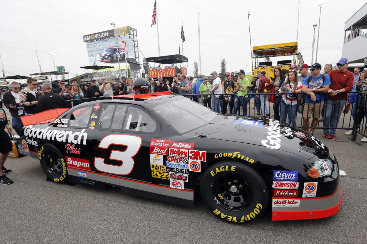 The No. 3 car of the late NASCAR driver Dale Earnhardt Sr. sits on pit road before a NASCAR Cup Series auto race at Talladega Superspeedway, Sunday, Oct. 13, 2019, in Talladega, Ala. (AP Photo/Butch Dill)