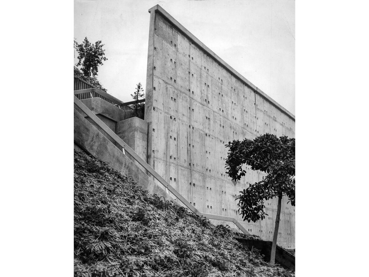 Dec. 16, 1955: Barren wall of Ft. Moore Pioneer Memorial, under construction on Hill Street next to the Hollywood Freeway.