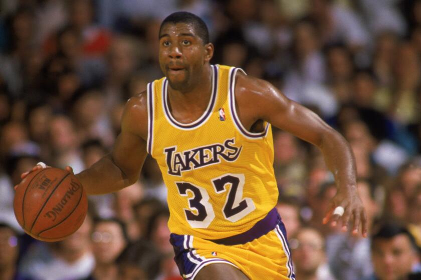LOS ANGELES – 1987: Magic Johnson @@#32 of the Los Angeles Lakers dribbles the ball during an NBA game at the Great Western Forum in Los Angeles, California in 1987. (Photo by: Rick Stewart/Getty Images)
